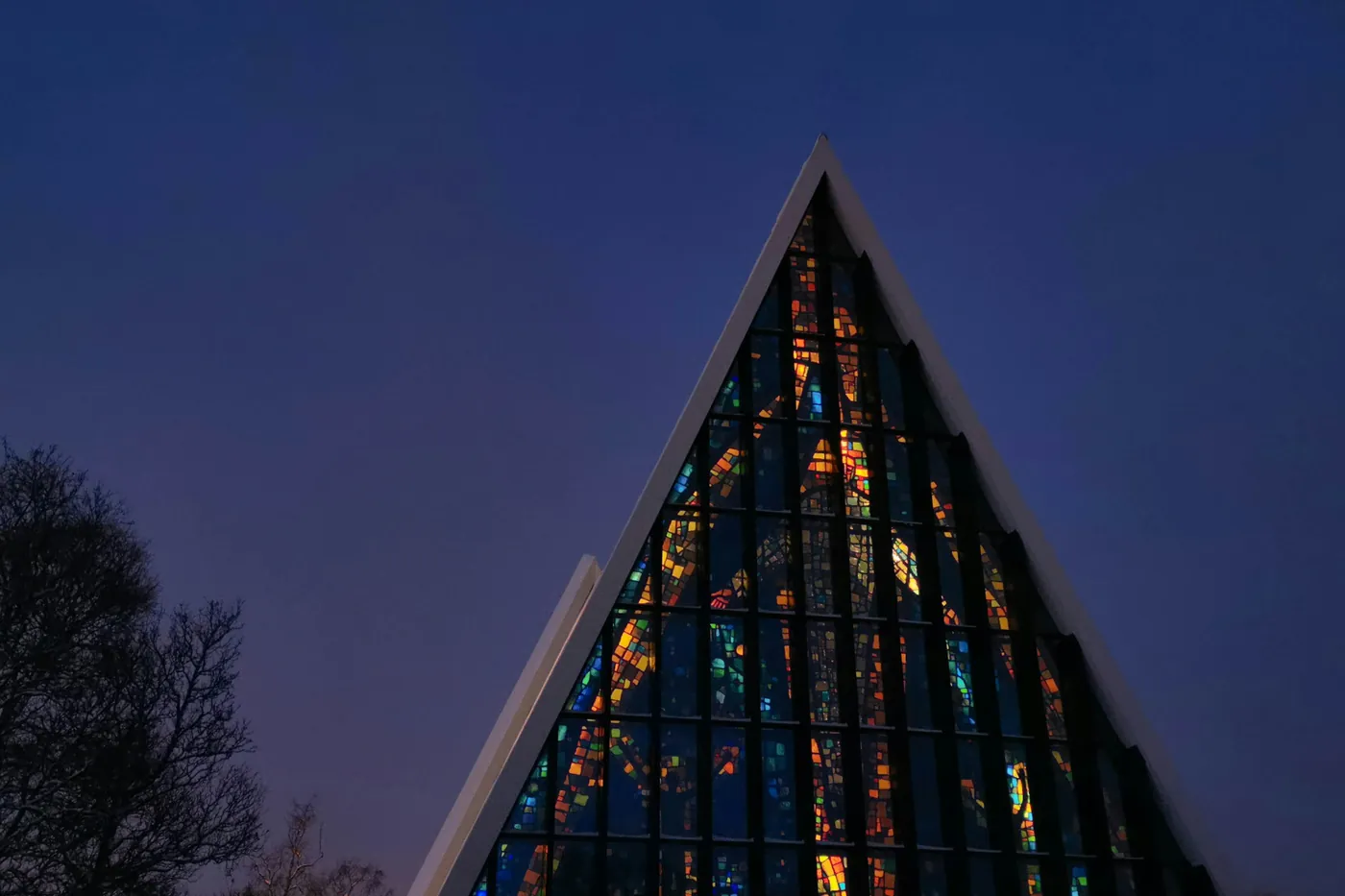 Glass mosaic of the Arctic Cathedral seen from outside at night
